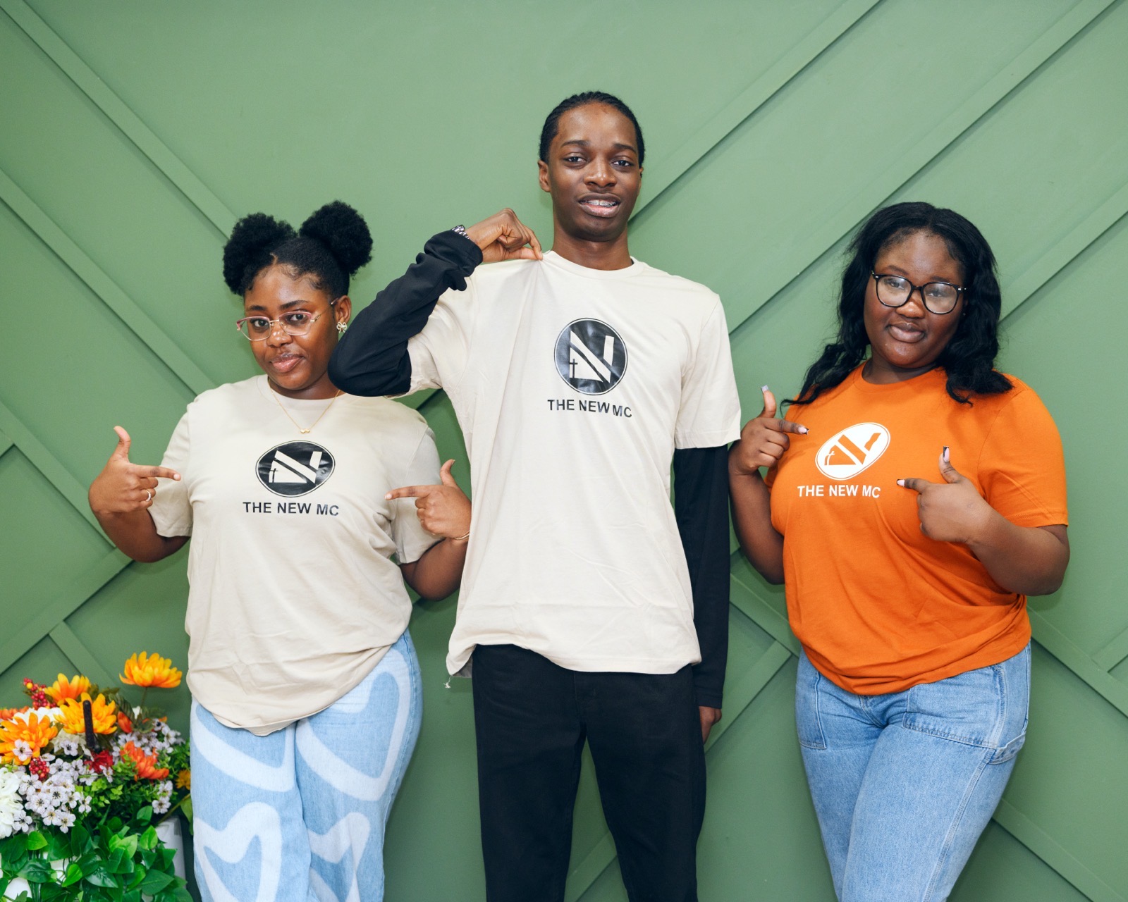 New MC members in branded shirts